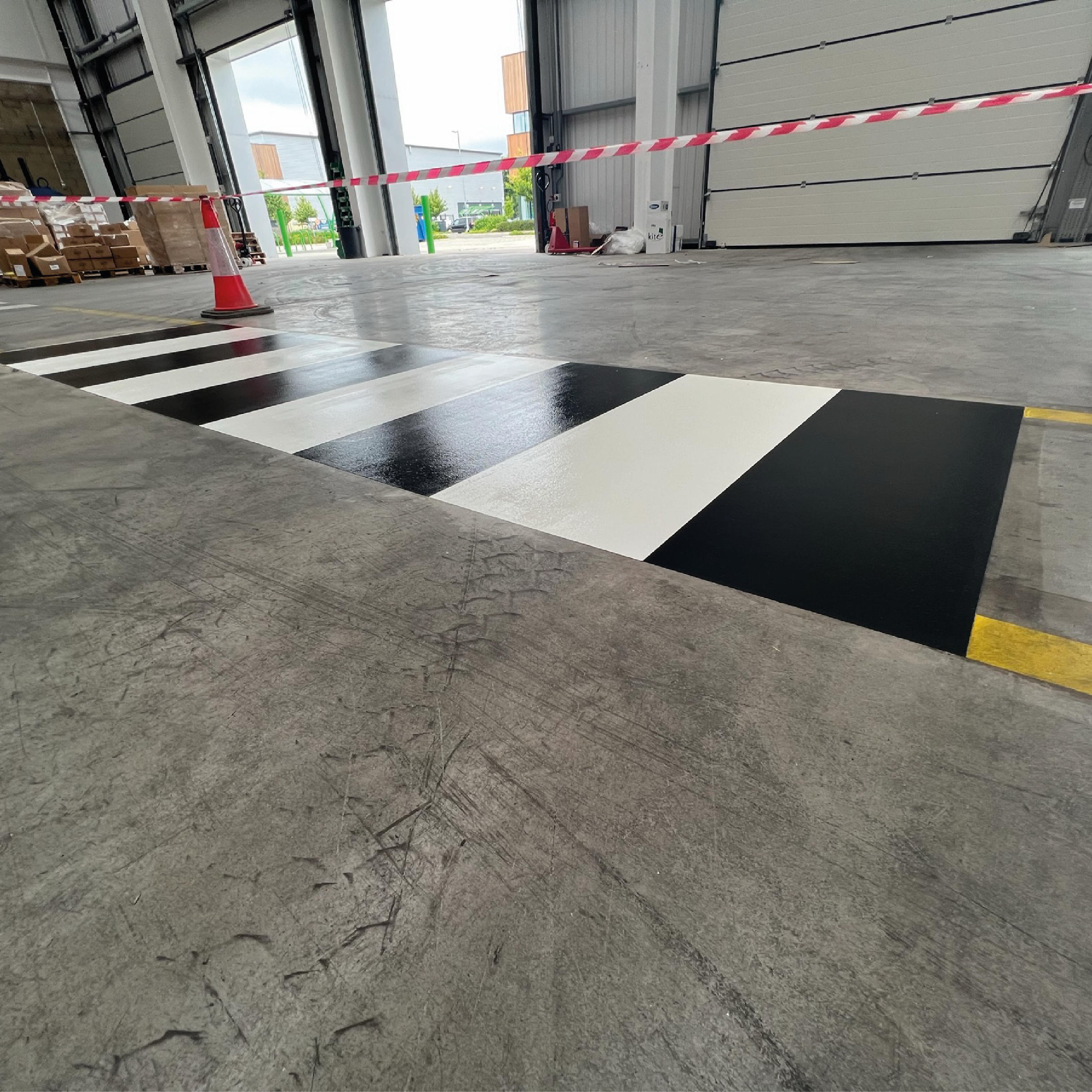 ClearSealF260 Applied on a warehouse walkway crossing