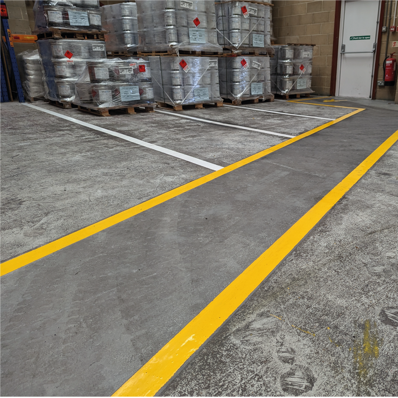 EliteLine Q920 Polyaspartic Line Marking Paint on the floor of a warehouse